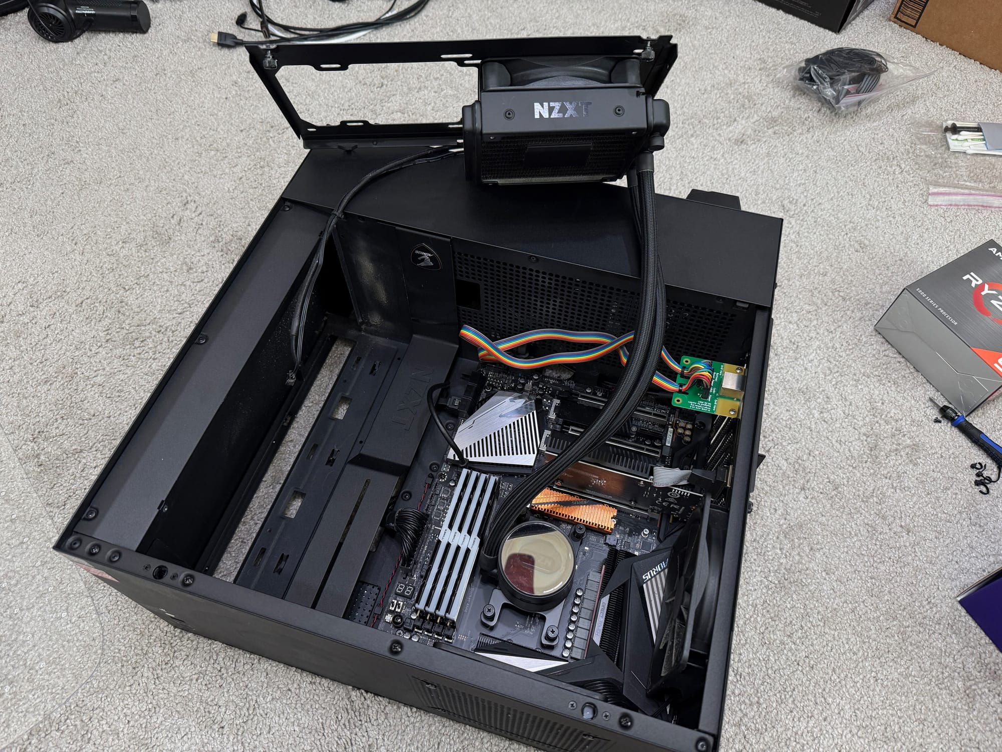 photo of my homelab machine on the floor with the cooler already partially removed